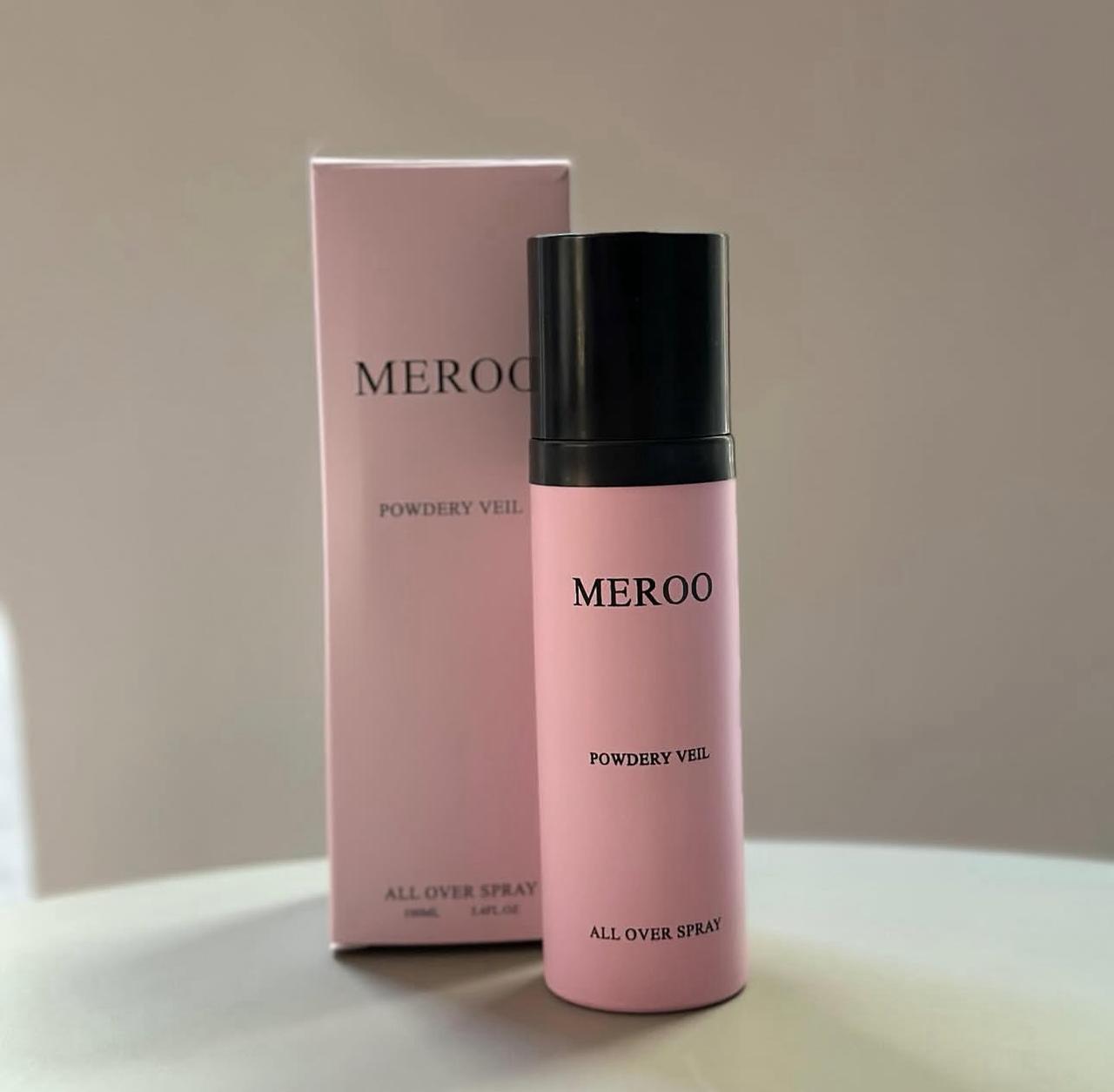 MEROO Powdery Veil All Over Spray — blush pink bottle with a black cap beside its matching pink carton